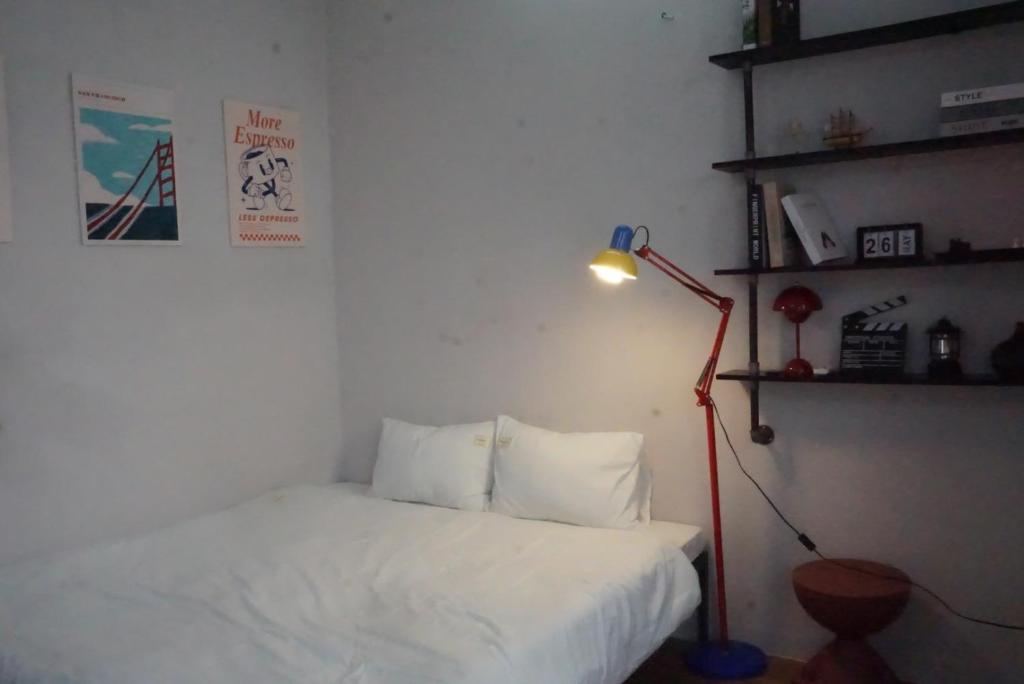 Postel nebo postele na pokoji v ubytování Mơ Màng Homestay