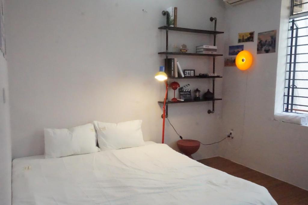 Postel nebo postele na pokoji v ubytování Mơ Màng Homestay