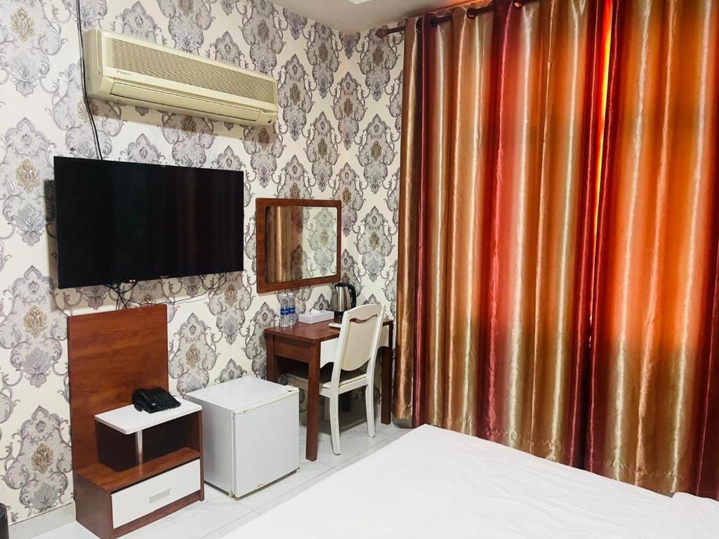 TV a/nebo společenská místnost v ubytování Grand Inn Hotel By Wanasa