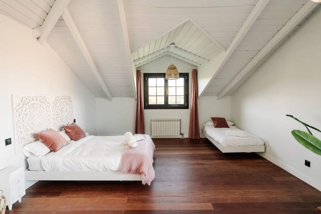 Posteľ alebo postele v izbe v ubytovaní Casa Rural Camino Blanco