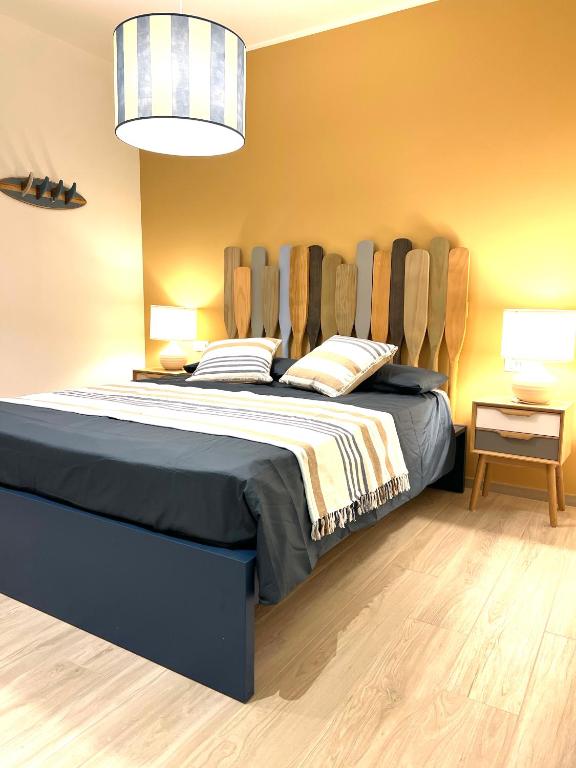 a bedroom with a large bed in a room at Appartamento Cielo e Mare in Pietra Ligure