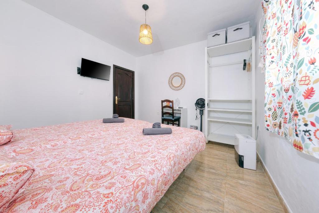 Postel nebo postele na pokoji v ubytování NoPasaNada Tu casa en Lanzarote
