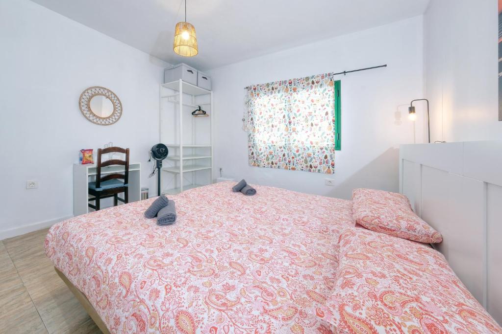 Postel nebo postele na pokoji v ubytování NoPasaNada Tu casa en Lanzarote