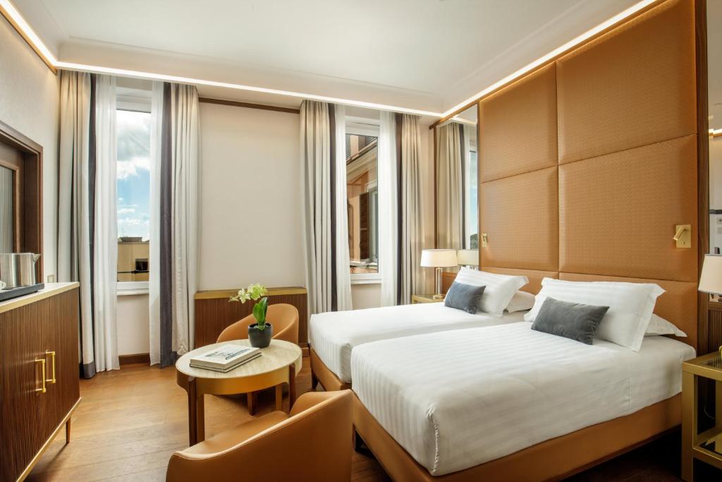 Postel nebo postele na pokoji v ubytování Hotel Imperiale by OMNIA hotels