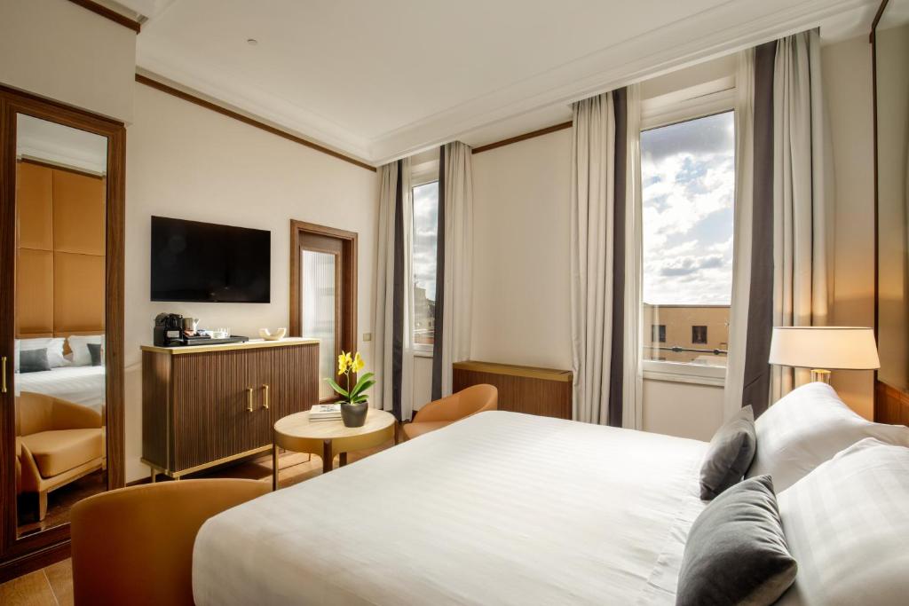 Postel nebo postele na pokoji v ubytování Hotel Imperiale by OMNIA hotels