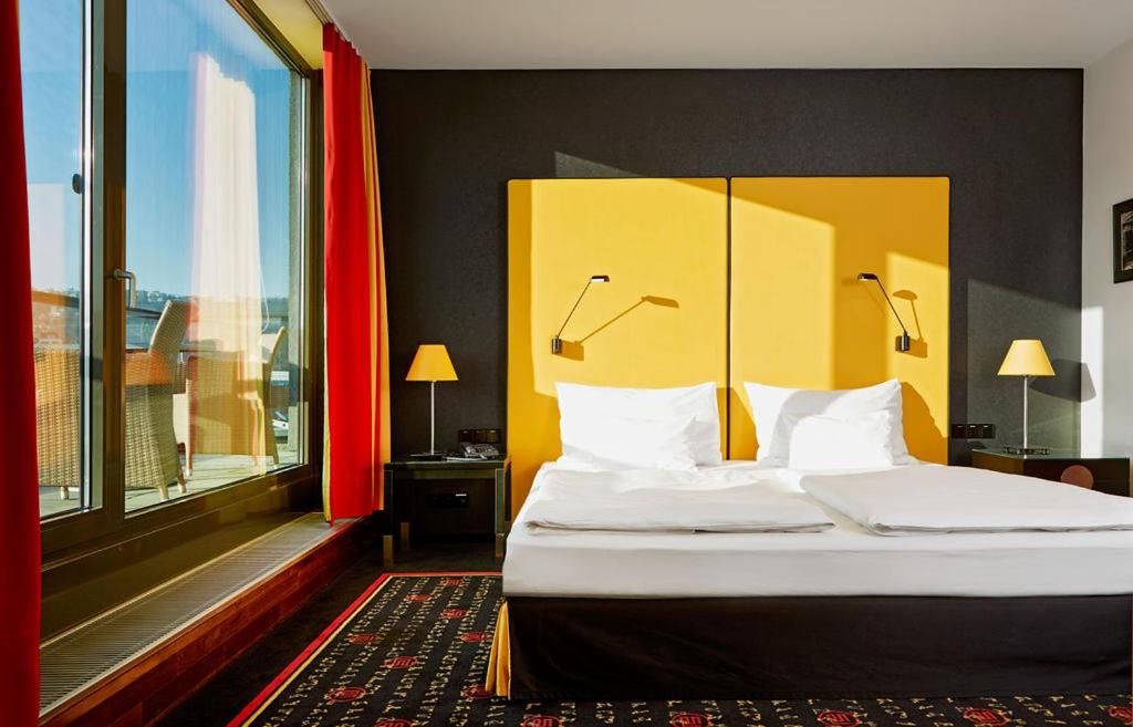 Postel nebo postele na pokoji v ubytování OREA Hotel Angelo Praha