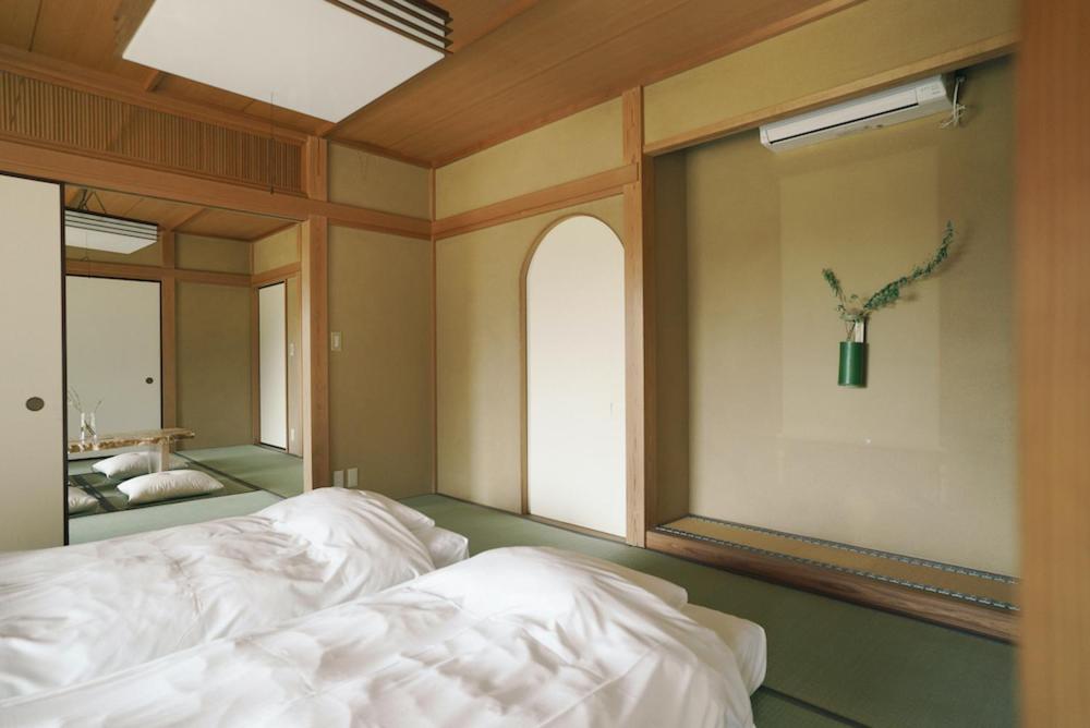 Postel nebo postele na pokoji v ubytování 赤城宿 珠蕾山荘-shurai-