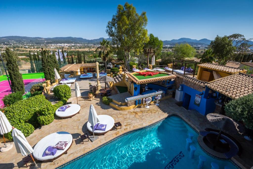 an aerial view of a pool at a resort at Pikes Ibiza in San Antonio