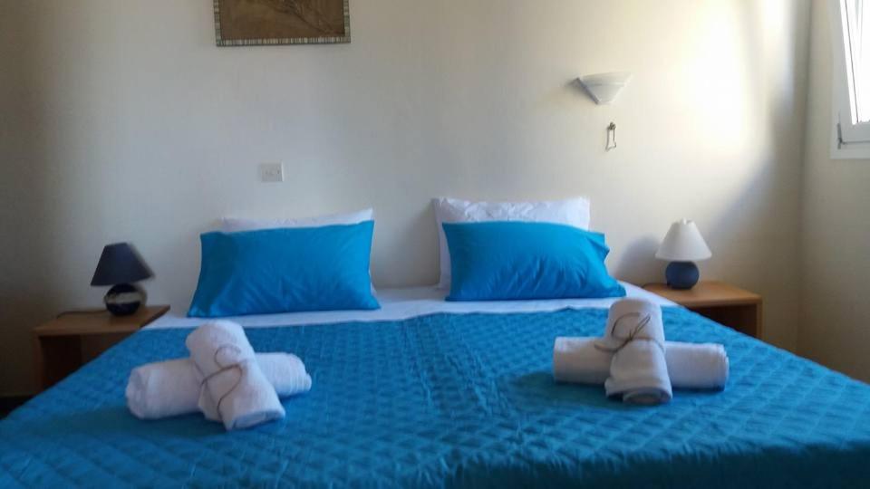 Кровать или кровати в номере Elia Houses