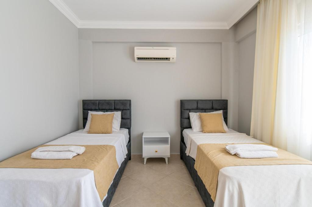 A bed or beds in a room at Hanel Life Royal Villas 7 Aqualettings