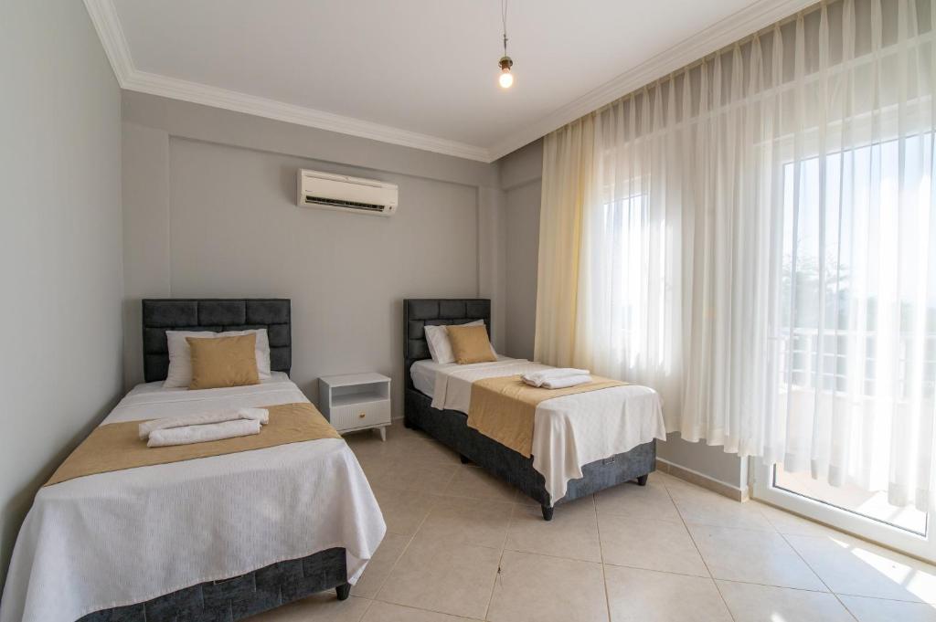 A bed or beds in a room at Hanel Life Royal Villas 7 Aqualettings