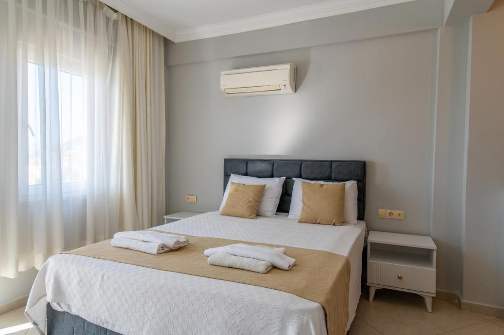 A bed or beds in a room at Hanel Life Royal Villas 7 Aqualettings