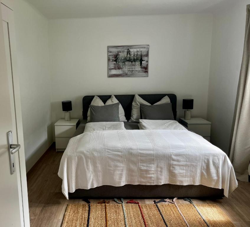 Postel nebo postele na pokoji v ubytování Ferienwohnung Auszeit Döbriach