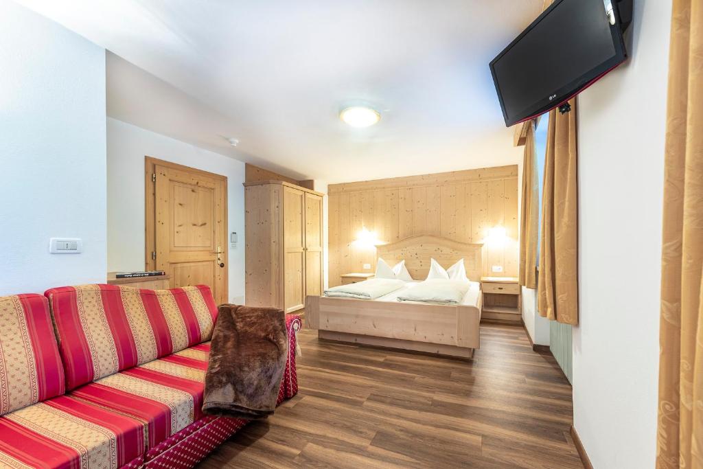 Postel nebo postele na pokoji v ubytování Hotel Jagdhof