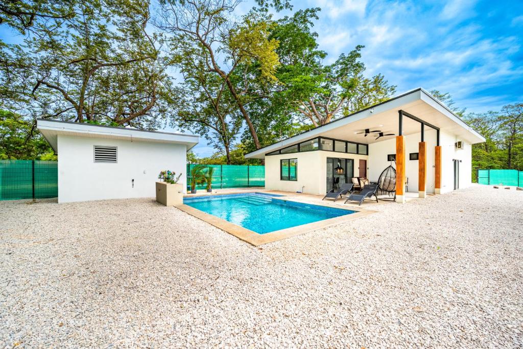 a home with a swimming pool in the backyard at Casa Montana Azul @ Catalina Cove in Brasilito