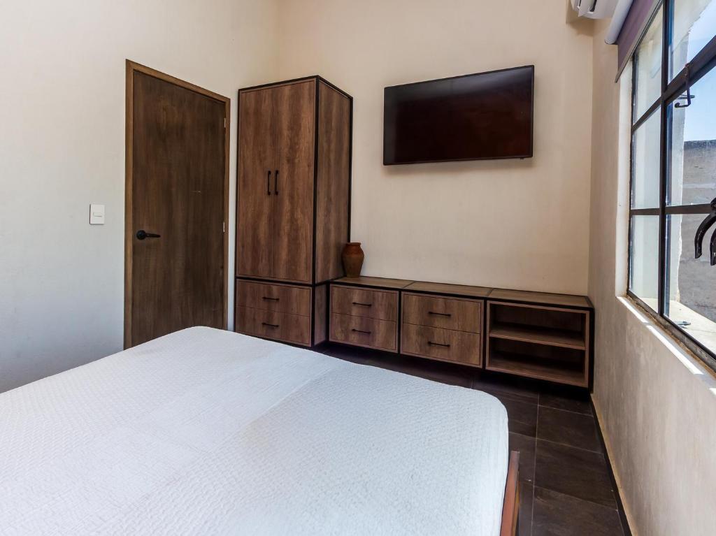 Postel nebo postele na pokoji v ubytování Ihost Chapultepec