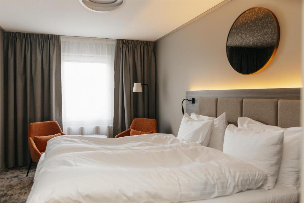 Postel nebo postele na pokoji v ubytování Best Western Plus Kalmarsund Hotell