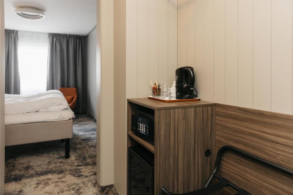 Postel nebo postele na pokoji v ubytování Best Western Plus Kalmarsund Hotell