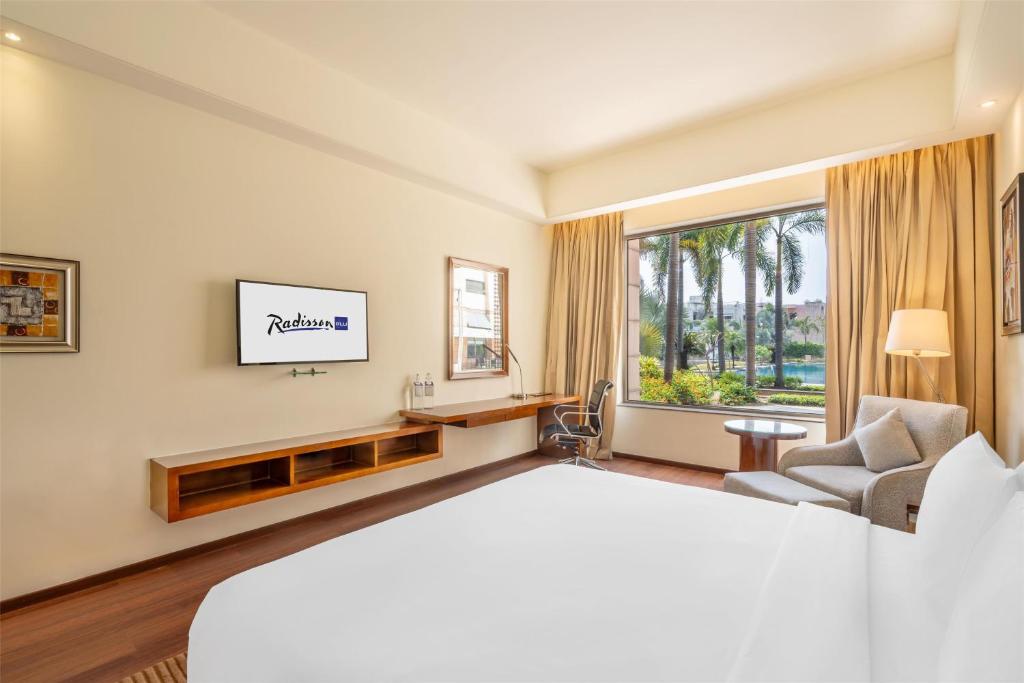 Postel nebo postele na pokoji v ubytování Radisson Blu Hotel Rudrapur