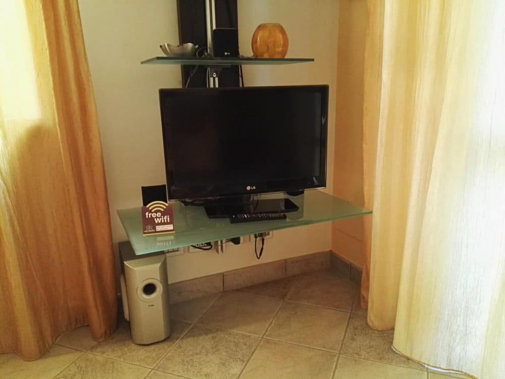 TV a/nebo společenská místnost v ubytování Rosta Residence Ranverso