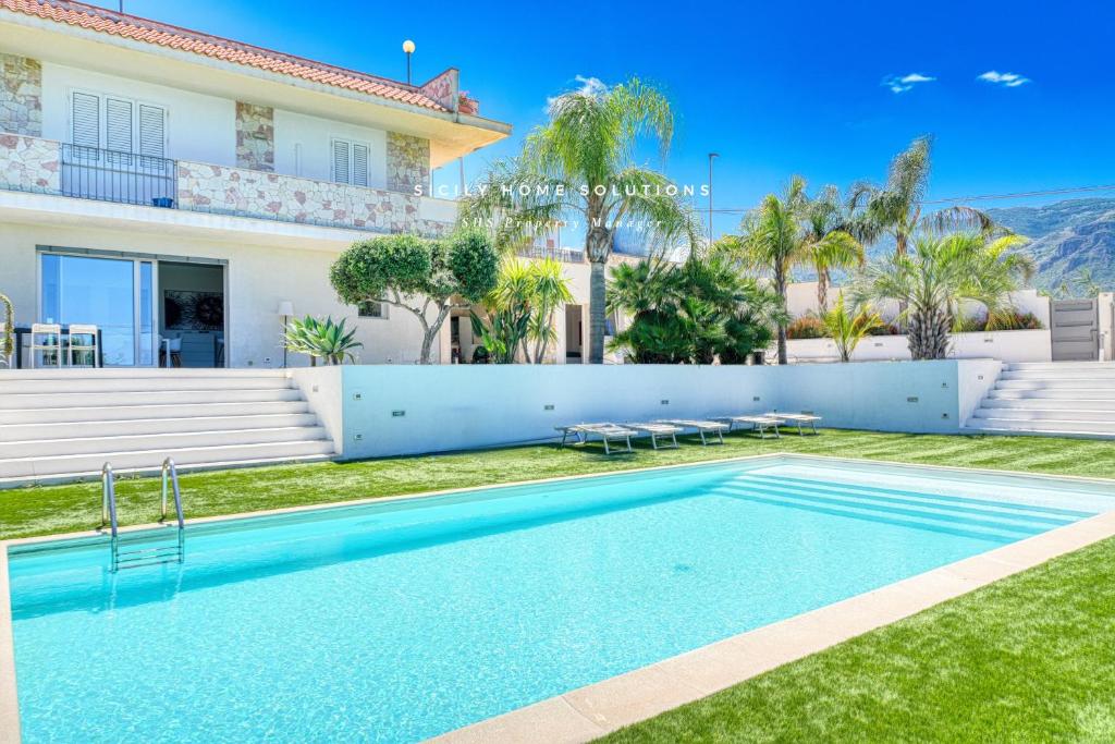 a swimming pool in the backyard of a house at Oasi Elegante Piscina di Lusso - vista panoramica By Sicily Home Solutions in Alcamo