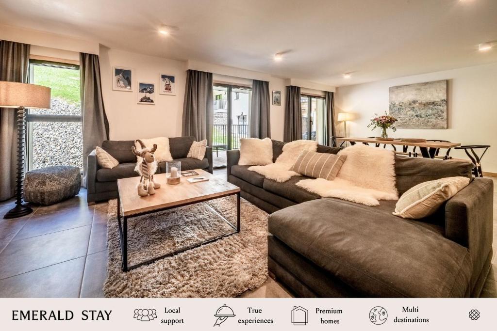 a living room with a couch and a table at Apartment Mathilde Les Houches - by EMERALD STAY in Les Houches