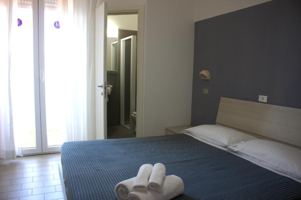 Postel nebo postele na pokoji v ubytování Hotel Atlas