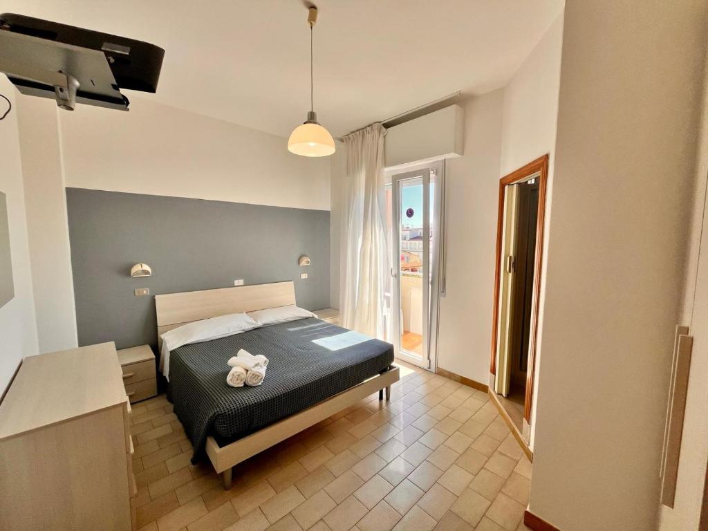 Postel nebo postele na pokoji v ubytování Hotel Atlas