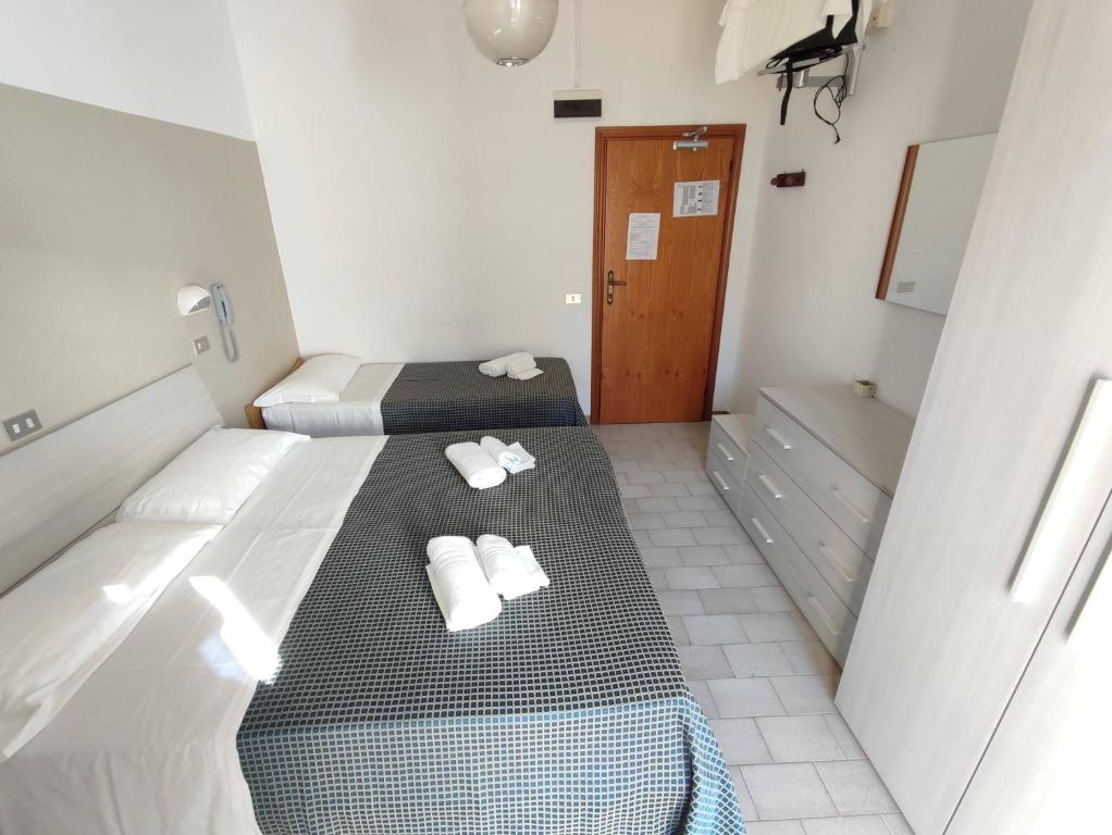 Postel nebo postele na pokoji v ubytování Hotel Atlas