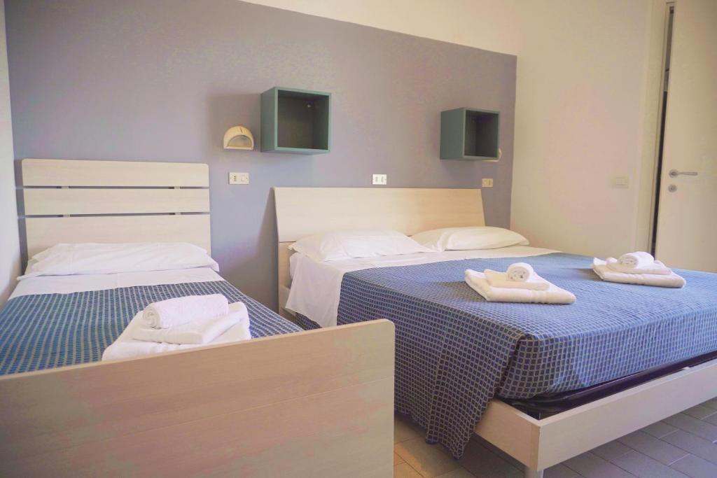 Postel nebo postele na pokoji v ubytování Hotel Atlas