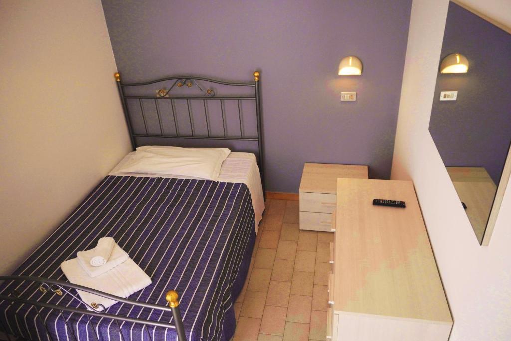 Postel nebo postele na pokoji v ubytování Hotel Atlas