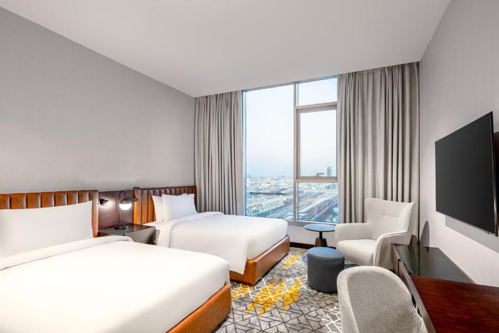 Postel nebo postele na pokoji v ubytování Four Points by Sheraton Jeddah King Fahd Road