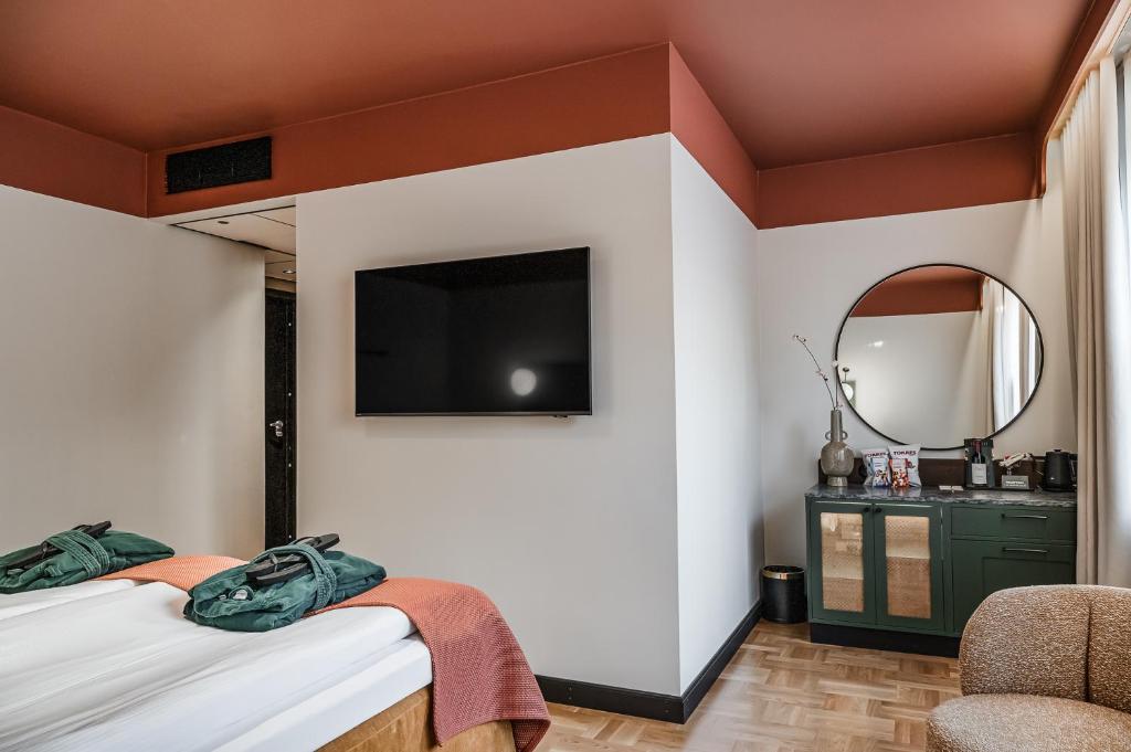 TV a/nebo společenská místnost v ubytování Hotel Fratelli