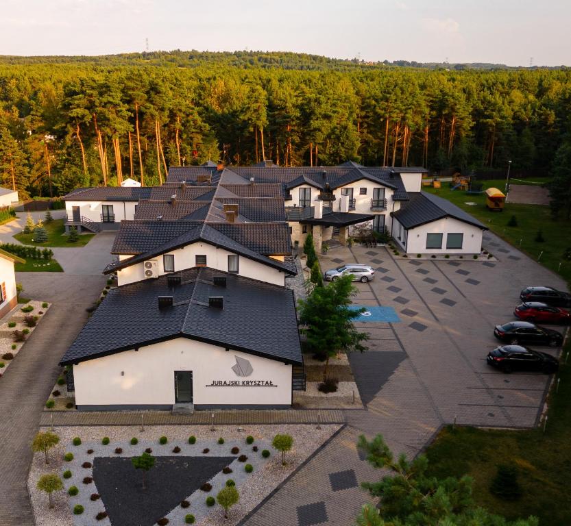 an aerial view of a house with a parking lot at Jurajski Kryształ in Zaborze