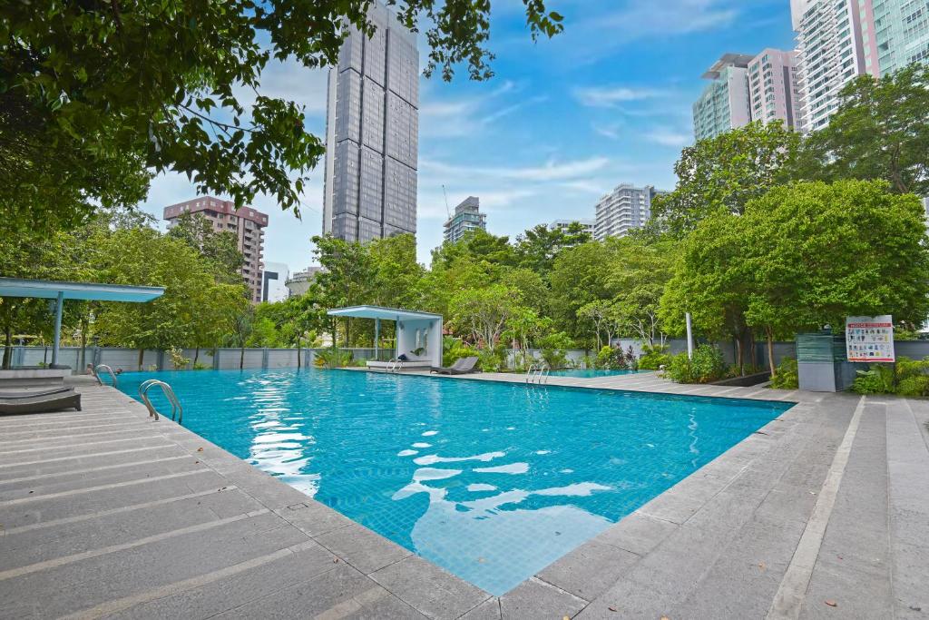 a swimming pool in a city with tall buildings at Palette Bukit Bintang Formerly Suasana Suites in Kuala Lumpur