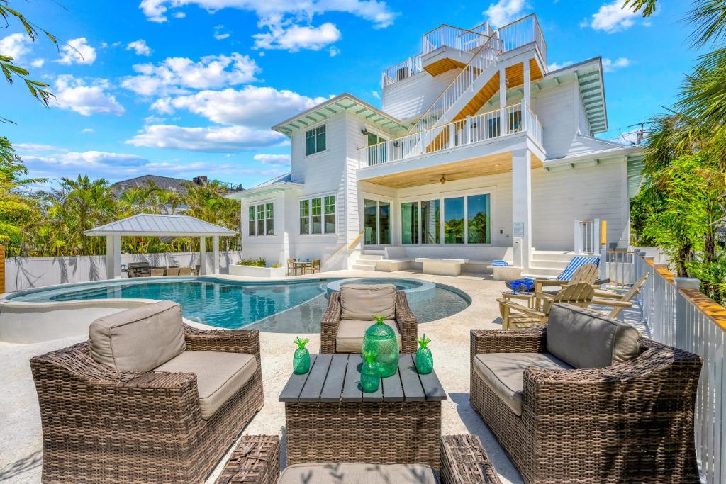 a home with a swimming pool and a house at Beach Fanta Sea - 149 in Bailey Hall
