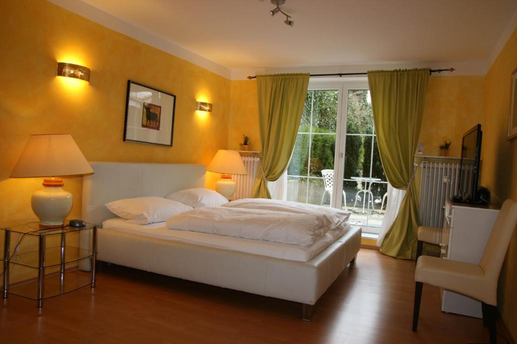 מיטה או מיטות בחדר ב-Hotel Stadtresidenz