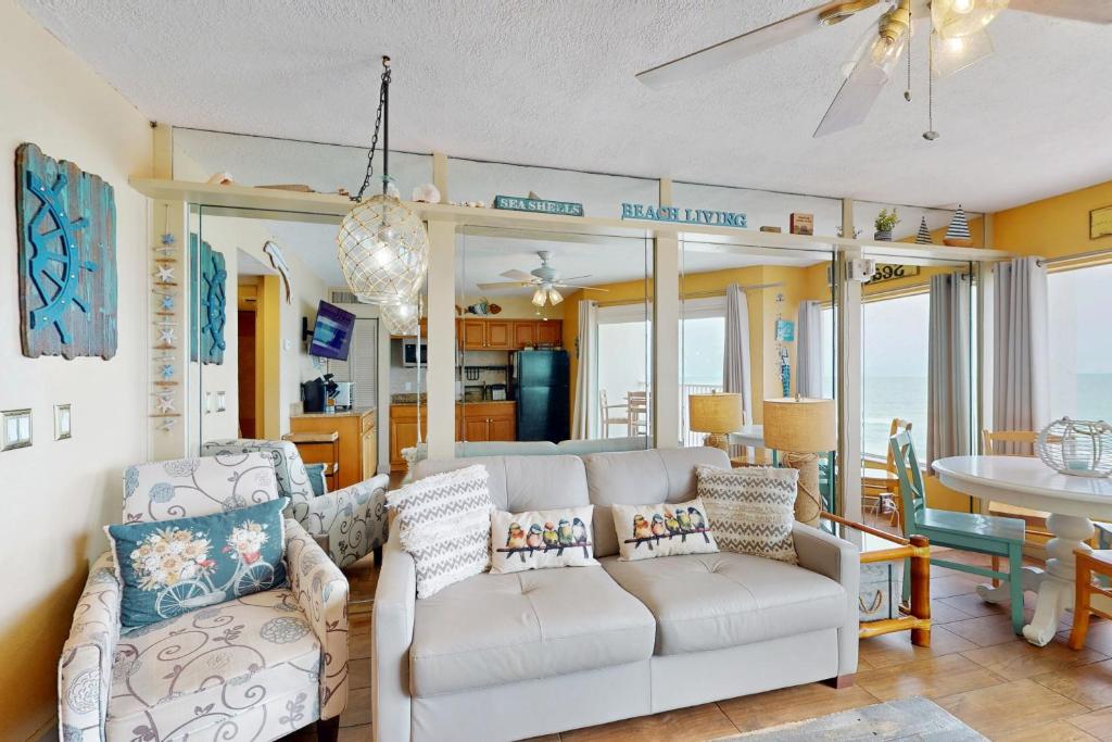 a living room with a couch and a table at Belleair Beach Club 312 in Clearwater Beach