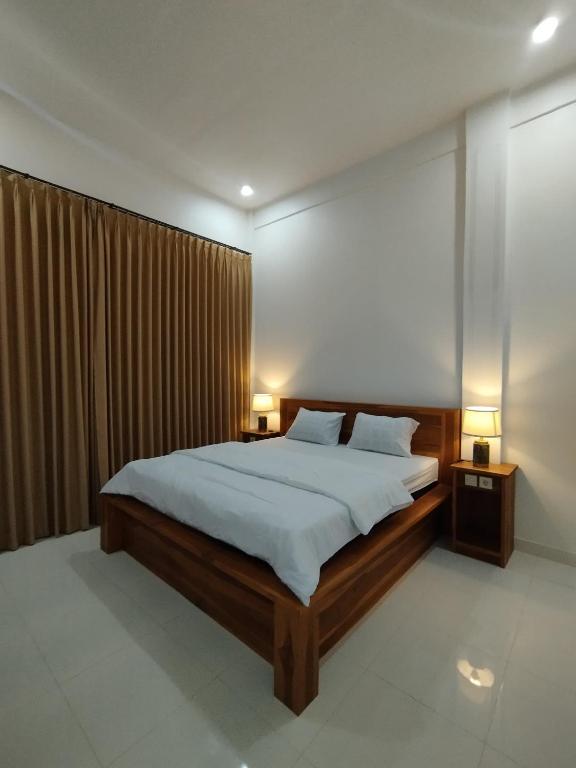 Postel nebo postele na pokoji v ubytování Nêst Guesthouse Tetebatu