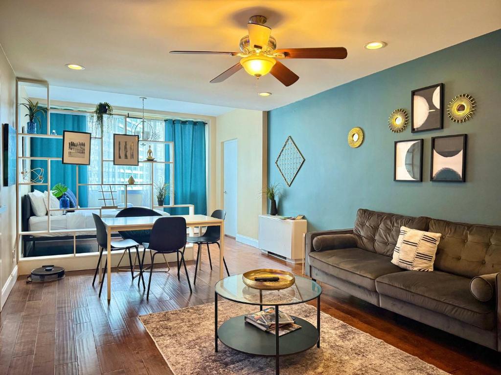 a living room with a couch and a table at Downtown! 2BD City view Onsite Parking King LM809 in Atlanta
