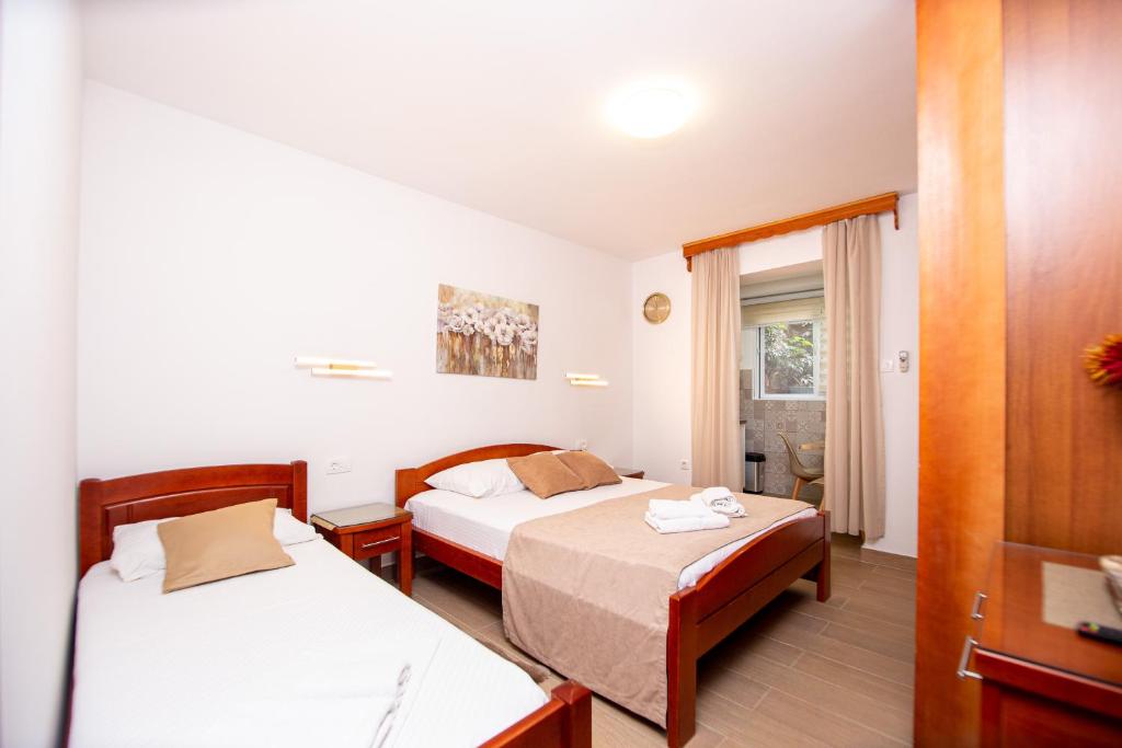 Krevet ili kreveti u jedinici u okviru objekta Jadran Apartments
