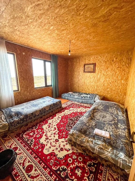 Кровать или кровати в номере Eco Farm Manjyly Ata