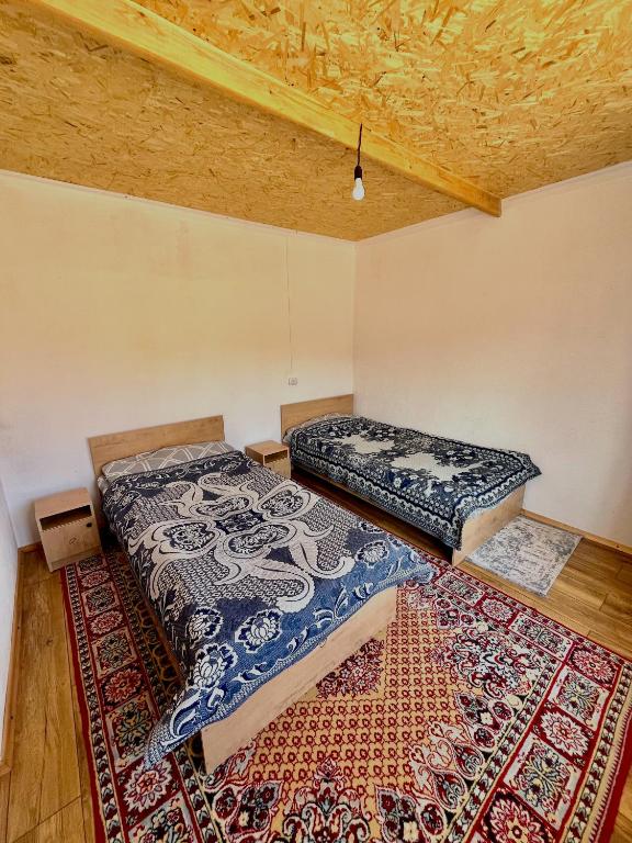 Кровать или кровати в номере Eco Farm Manjyly Ata