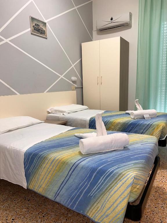 Кровать или кровати в номере Hotel moroni