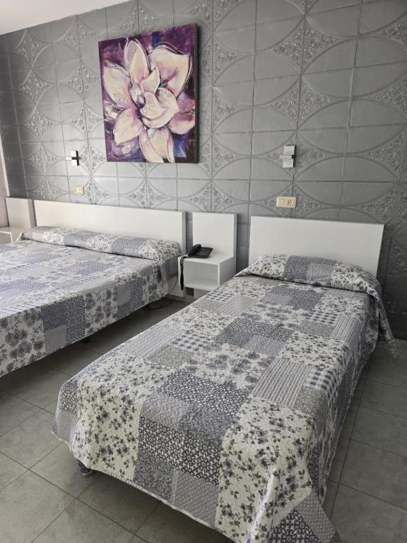 Postel nebo postele na pokoji v ubytování Ampuria Inn