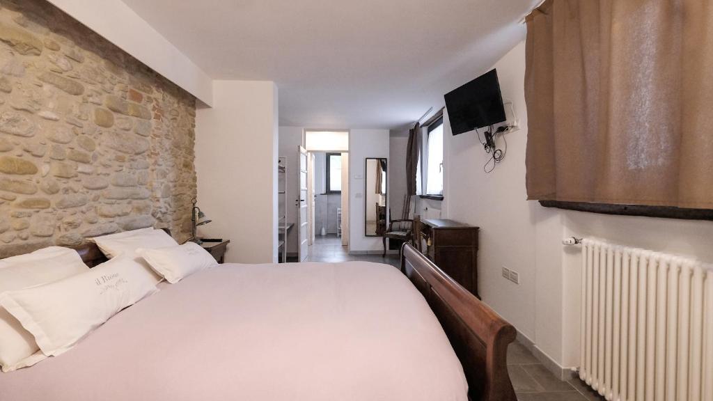 Postel nebo postele na pokoji v ubytování B&B Appartamento - IL RIONE