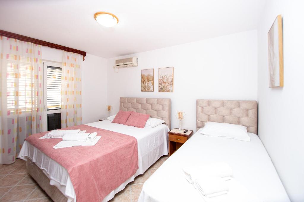 Krevet ili kreveti u jedinici u okviru objekta Jadran Apartments