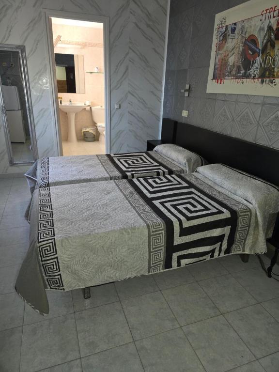 Postel nebo postele na pokoji v ubytování Ampuria Inn