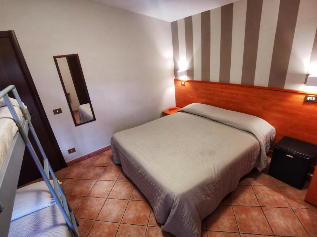 Postel nebo postele na pokoji v ubytování Hotel Piscina La Suite