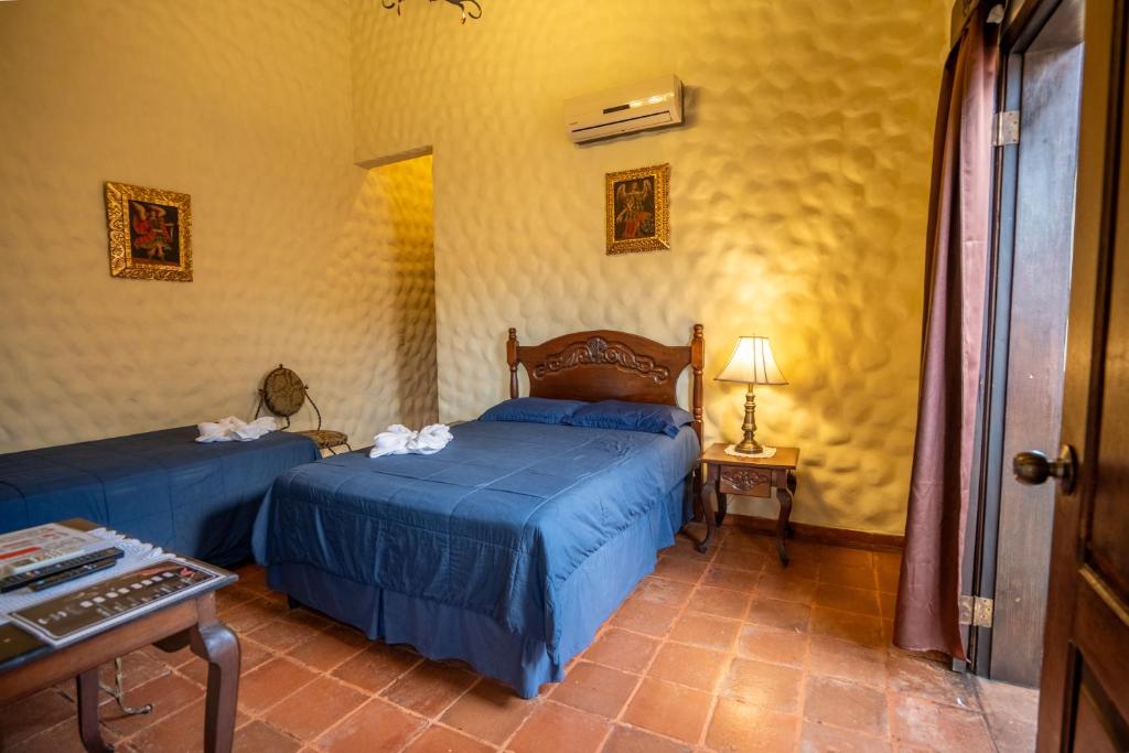 Ένα ή περισσότερα κρεβάτια σε δωμάτιο στο Hotel Caxa Real
